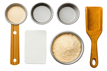 Wooden measuring cup, flour spatula, notepad, and metal measuring bowls isolated with transparent background