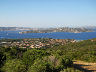Panoramic View of Palau, Sardinia with La Maddalena Islands. Stunning panoramic view of Palau, a picturesque coastal town in northern Sardinia, Italy, overlooking the shimmering turquoise waters of