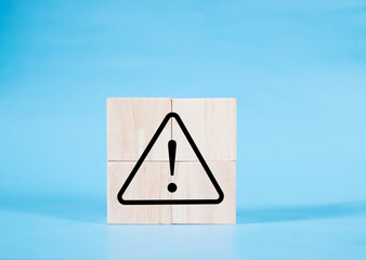 Black exclamation warning sign or caution symbol consisting of sticks on blue background for...