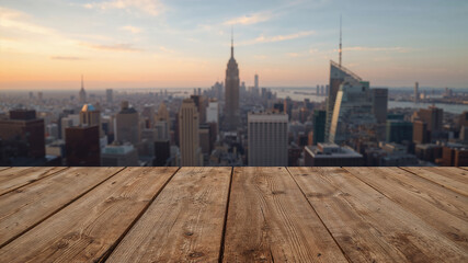 Fototapeta premium Wooden deck overlooking iconic city skyline at sunset