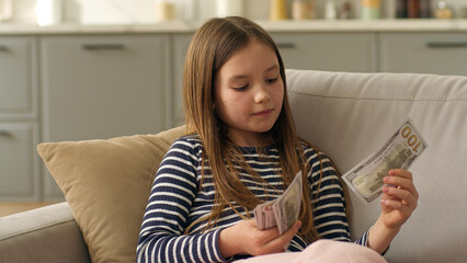 Little girl count money dollar bills finance child kid currency paying banking business budget...