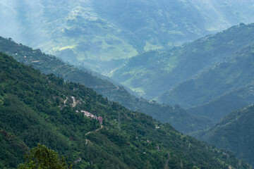 Sun rays falling on Himalayan mountain range, scenic beauty of layers of mountains, Okhrey, sikkim,...