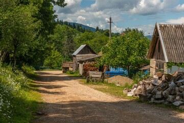 village street in the mountains of the Western Caucasus on a sunny June day