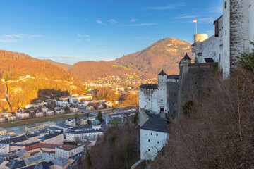 Obraz premium Outer walls of Hohensalzburg Fortress overlooking Salzburg at sunset in Austria