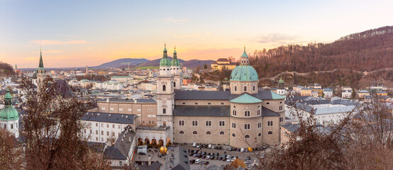 Aerial view of Salzburg Cathedral and historic old town at sunset in Salzburg, Austria © Kavalenkava