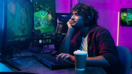 Bored Indian Arabian Latino man tired guy monitor computer networking cyberspace programmer gamer...