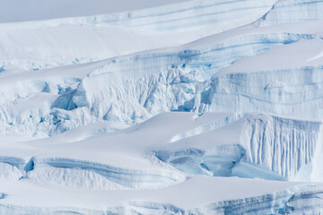 A tranquil Antarctic landscape, near Graham passage along Charlotte Bay, highlighting stark...