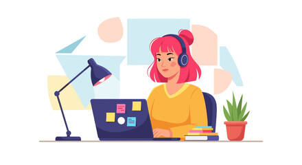 A young woman with pink hair and headphones works on her laptop at her desk, surrounded by a lamp, books, and a plant in a modern, bright setting.