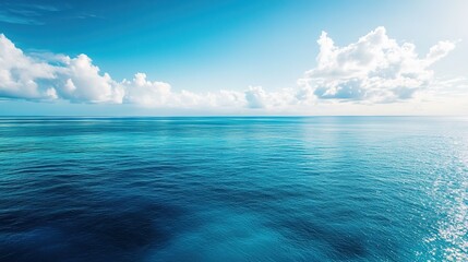 Obraz premium Drone Aerial View of Vast Ocean with Distant Coral Reefs Under Clear Blue Sky, Serene Seascape in High Resolution.