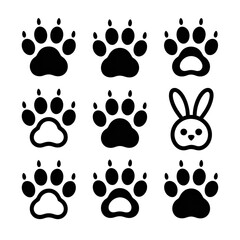 Fototapeta premium Cute Cartoon Animal Paw Prints and Bunny: Simple Line Art Graphics Set for Children's Designs.