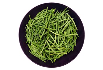Top view of freshly trimmed and cleaned string beans (ambelofasoula in Greek) in a bowl, isolated...