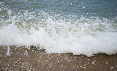 Sea wave on the sandy beach. Selective focus. Nature.