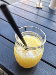 Refreshing citrus drink on a sunny day at an outdoor cafe table