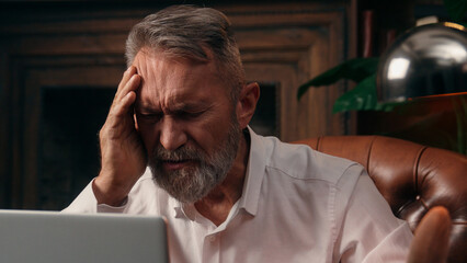Confident successful old Caucasian man male mature takes off glasses looking at camera folded hands...