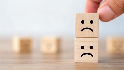 Cube with angry face icon being pushed away by other blocks — rejection due to bad experience
