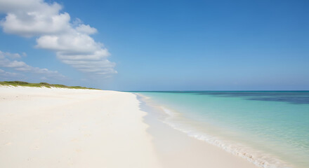 A pristine, white sand beach stretching into the distance, with calm, turquoise water gently lapping the shore. The sky is a clear, bright blue, and a few fluffy white clouds are scattered above. The 
