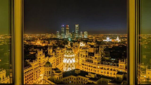 Stunning Sunset View Over Madrid Skyline From a High-Rise Window With City Landmarks Illuminated