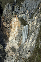 large waterfall in slovenia mountain rock cliff beautiful nature landscape hiking hike beauty trek julian alps bovec
