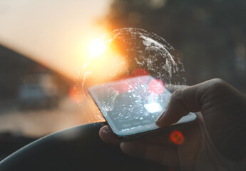 Hand using smartphone with AI interface in a car, digital globe overlay, symbolizing smart mobility and global connectivity.