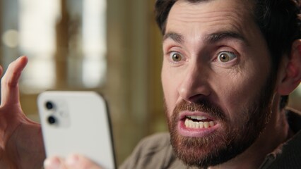 Angry stressed annoyed business man scream mobile phone problem irritated Caucasian businessman guy...
