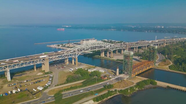 Serial shot reveals Hamilton's bridge network, framed by water, roads, and industrial skyline