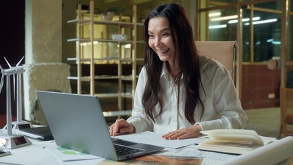 Asian woman business entrepreneur pensive businesswoman working engineering project green energy...