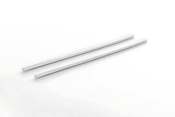 Elegant white chopsticks on a clean background for Asian cuisine and minimalist table setting