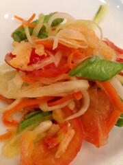 SOM TUM Thai, Thai spicy green papaya salad In white plate