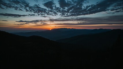 Fototapeta premium Sunrise over a mountain range.