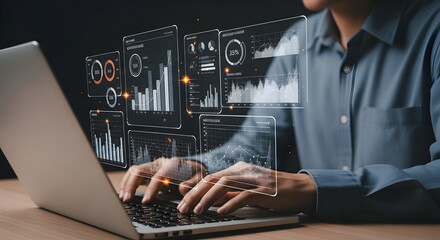 Professional analyzes digital data on a laptop with interactive holographic displays in a dark setting