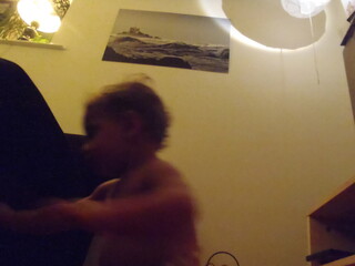 A blurry image of a child in a room.