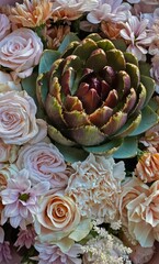 Obraz premium Artichoke in a bouquet of delicate flowers.A close-up of the central artichoke in a composition of cream roses, carnations and chrysanthemums in pastel shades in a pink package