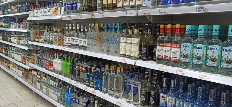 Moscow.Russia. Shelves with vodka and spirits in a supermarket in Russia. The photo shows famous Russian brands &mdash; Stolichnaya, Frost, Five Lakes, Belaya Sova and others.