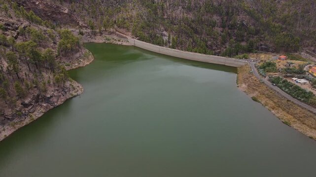 Los perez dam reflecting green water in gran canaria, canary islands
