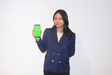 Asian Business Woman Confidently Showing Off Smartphone with Green Screen on Isolated White Background