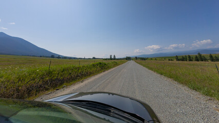Driving on a Gravel Road Through the Montana Countryside