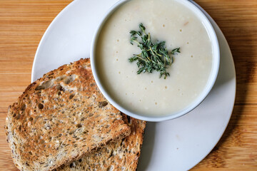  Bowl Of Traditional Chicken Soup With thyme Garnish And Toast