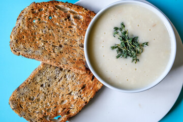  Bowl Of Traditional Chicken Soup With thyme Garnish And Toast