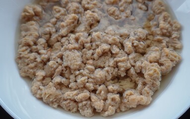 Soy meat in soaked form.
Large pieces of dried soy meat swelled in the water, turning into a soft,...