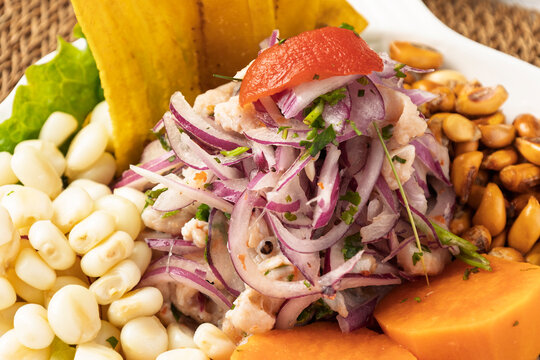 Delicious peruvian ceviche with cancha, choclo and patacones, creating a flavorful culinary experience