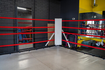 View of boxing ring inside gym.