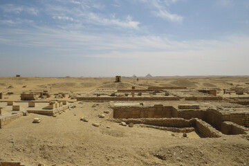 Archaeological landscape in the area of Saqqara. View of the Dhashur Pyramids at the rear. Egypt.