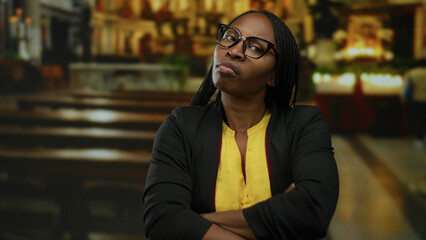 Woman with curly hair expressing frustration in a church setting, showcasing a beautiful moment of...