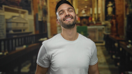 Young man smiling in a church setting, expressing joy and faith, capturing a moment of positivity...