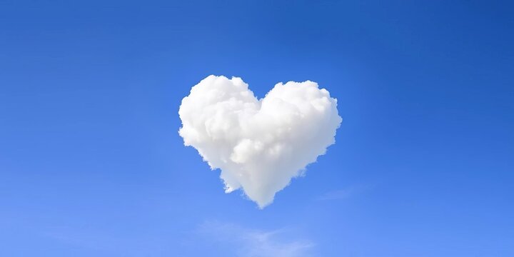 Heart-shaped white cloud floats serenely against a vibrant blue sky, blue, cloudscape