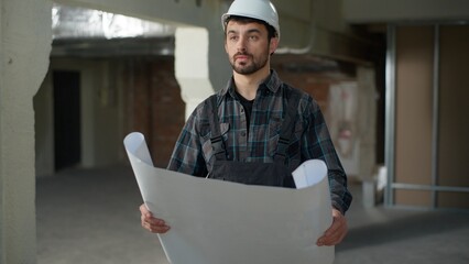 Caucasian man architect builder looking blueprint plan building construction male guy engineer...