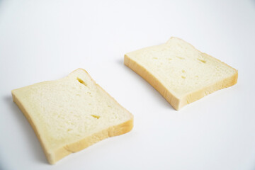 close up of bread slices against white background 