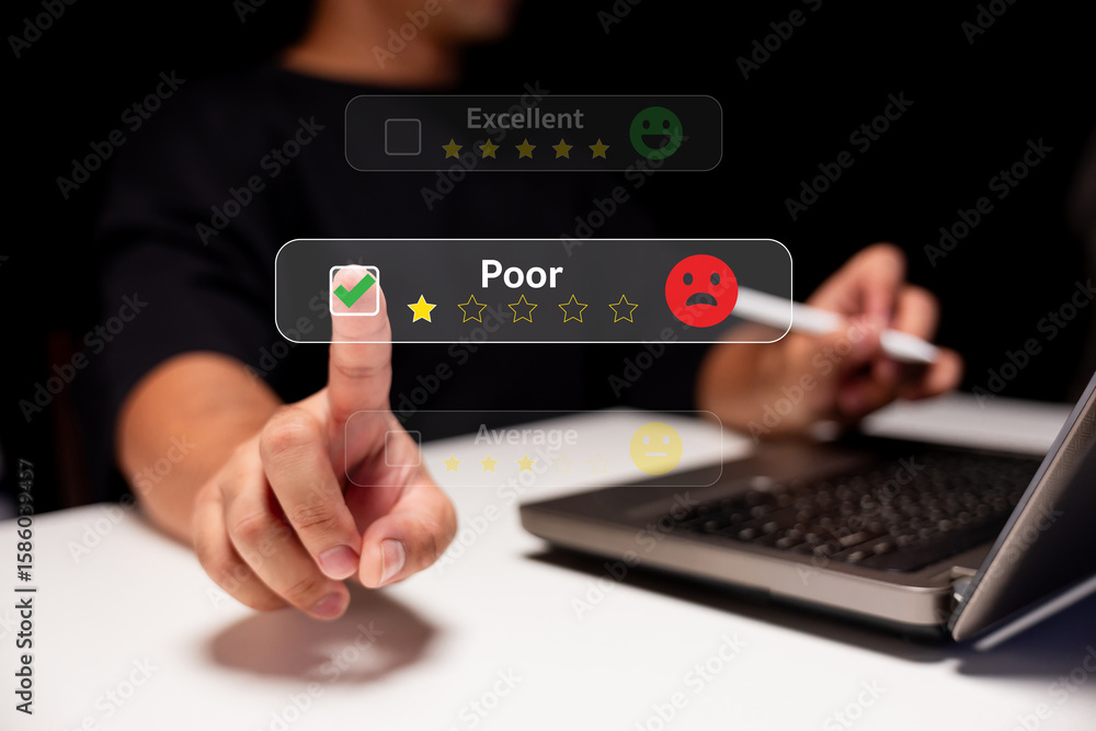 Poster a person uses a laptop to give a poor rating with a sad face icon, highlighting negative feedback on