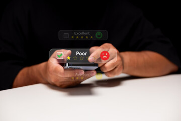 A person holding a smartphone, providing a poor rating with a sad face icon, highlighting user...