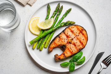 Grilled salmon steak with roasted green asparagus